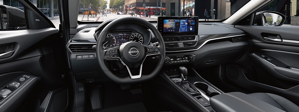 2024 Nissan Altima view from driver's seat showing gauges and 12 3-inch touch-screen illustrating connectivity