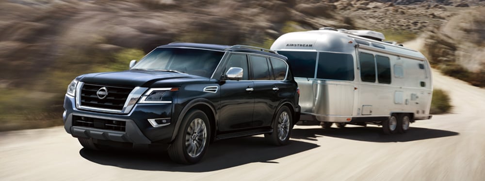 2024 Nissan Armada towing an airstream on mountain road