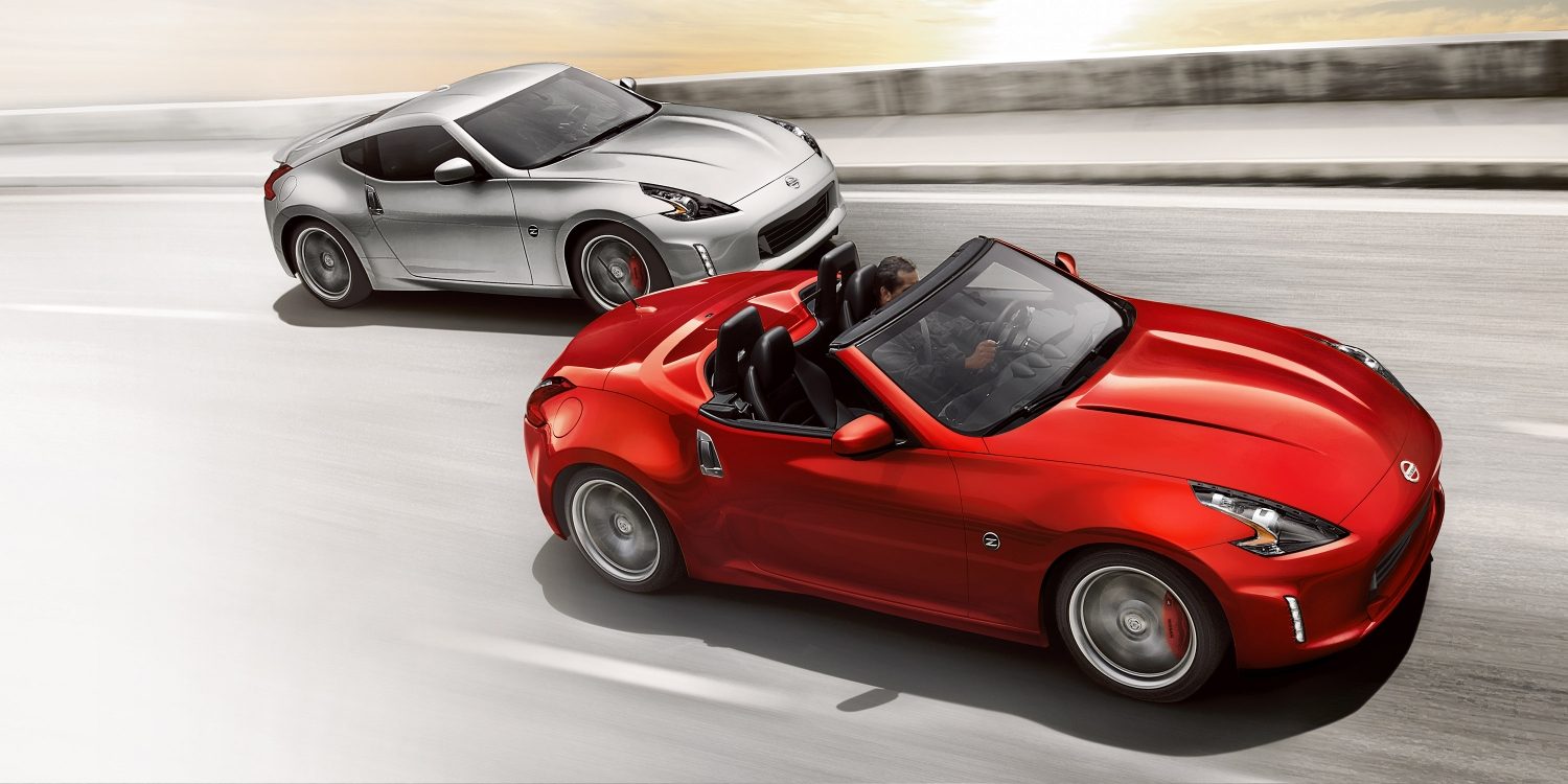 Nissan 370Z Roadster in motion on road with Nissan 370Z Coupe