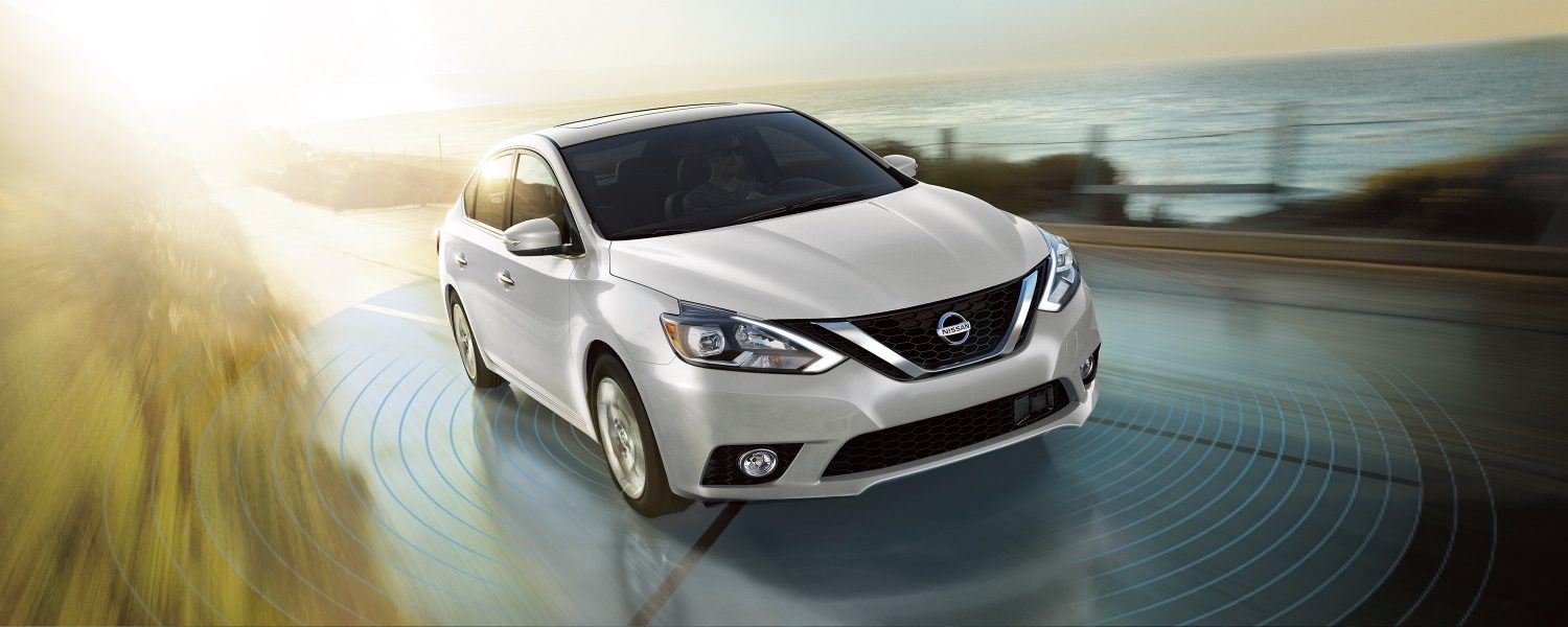 Nissan Sentra Exterior 3/4 front driving down road with sonar illustration