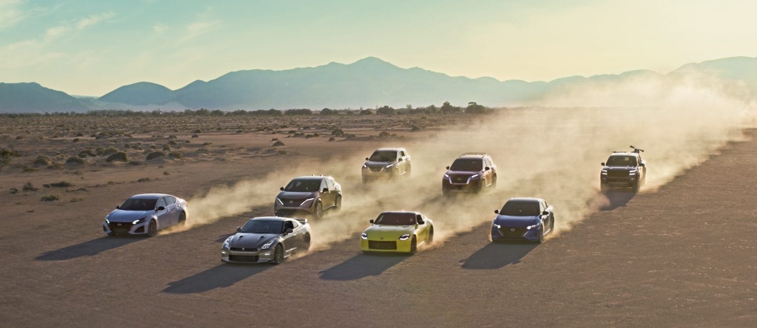 Nissan Z, GTR, Sentra, Altima, Murano, rogue and titan all driving through a desert