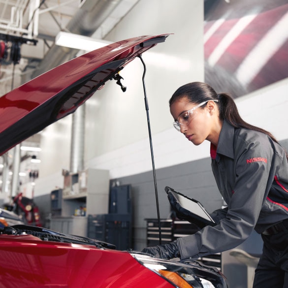 Nissan Business Fleet mechanic inspecting vehicle