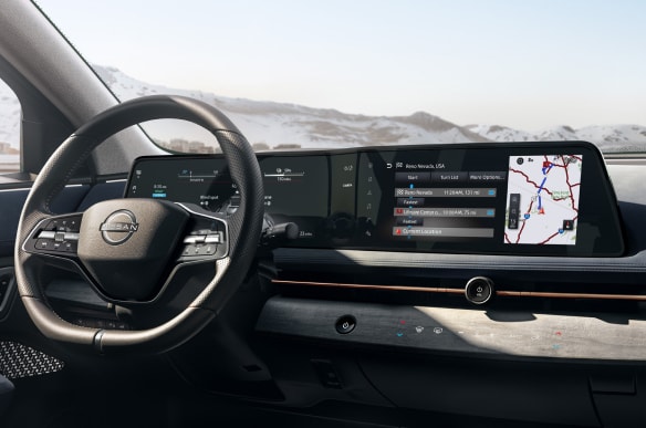 Interior view of Nissan ARIYA dashboard showing intelligent route planner feature