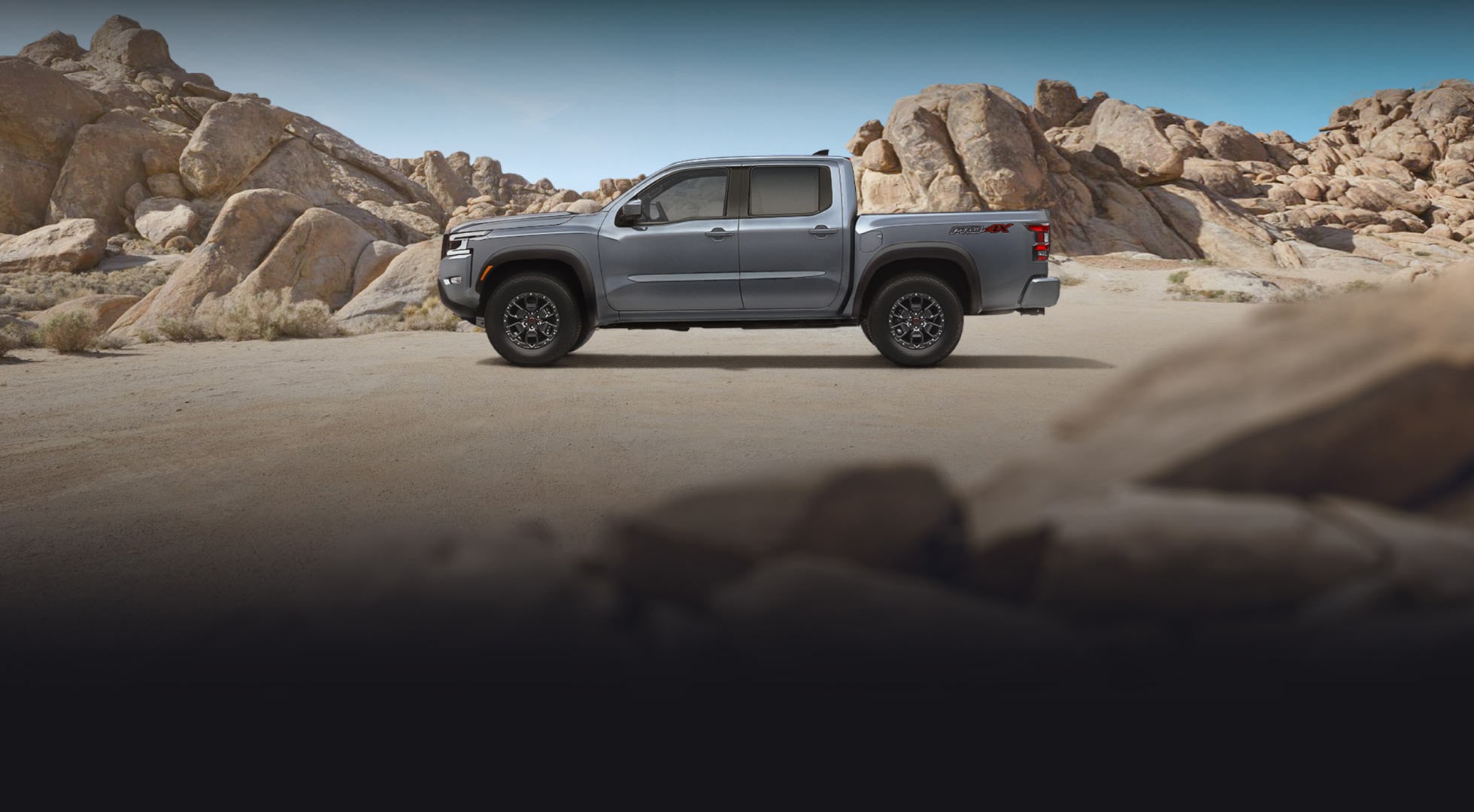 2023 Nissan Frontier in profile outdoors. 