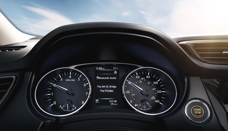 Nissan vehicle gauge cluster showing bluetooth screen