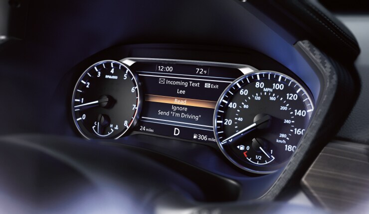 Nissan vehicle gauge cluster showing hands-free text messaging assistant