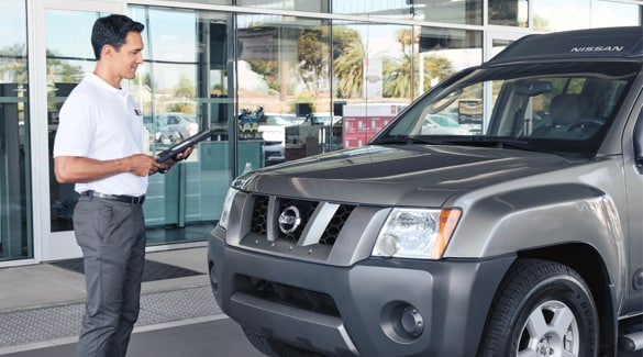 Nissan Technician Inspecting Vehicle For Active Recalls