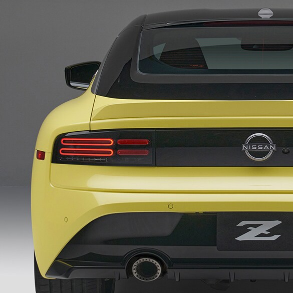 Rear View Of 2023 Nissan Z In Two-Tone Ikazuchi Yellow Tricoat And Super Black Exterior