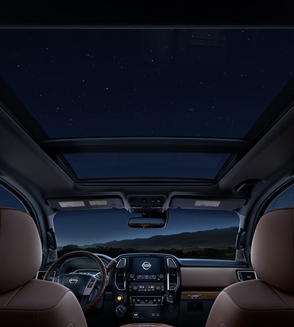 2021 Nissan TITAN view from backseat at night with dual panoramic moonroof and stars shining in
