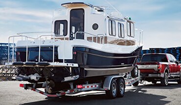 2021 Nissan TITAN towing a large boat