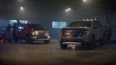 Nissan TITAN and TITAN XD parked inside a warehouse