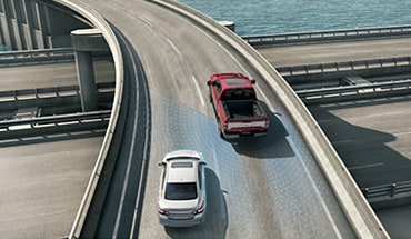 2021 Nissan TITAN XD on highway showing blind spot warning technology