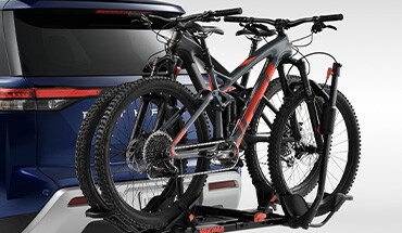 2023 Nissan TITAN affiliated Yakima® HoldUp 2 hitch mount bike rack.