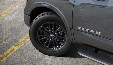 2023 Nissan TITAN 20-inch black aluminum-alloy wheels.