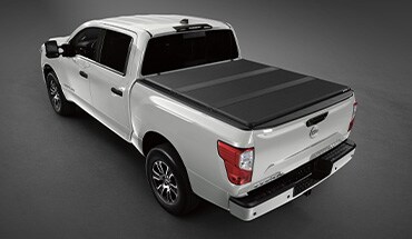 2023 Nissan TITAN affiliated Extang solid fold 2.0 truck bed cover.
