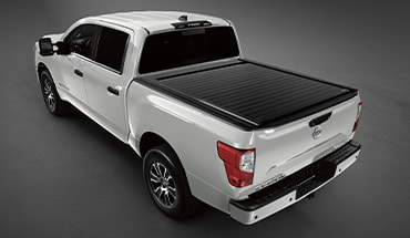 2023 Nissan TITAN affiliated RetraxONE retractable aluminum tonneau cover.