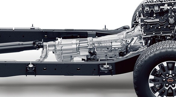 2023 Nissan TITAN 9-speed automatic transmission sitting in chassis on white background.