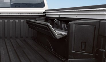 2023 Nissan TITAN bed with in-bed box open.