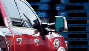 2023 Nissan TITAN red closeup of tow mirrors.