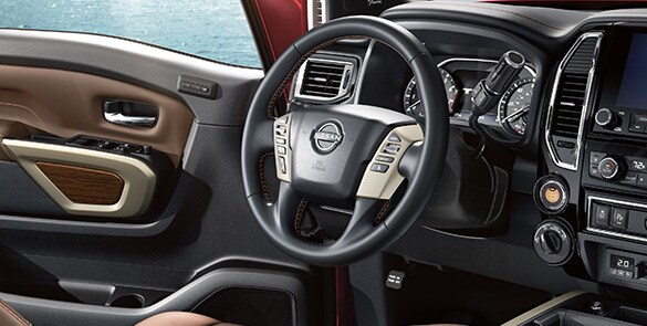 2023 Nissan TITAN Platinum Reserve heated leather-wrapped steering wheel.