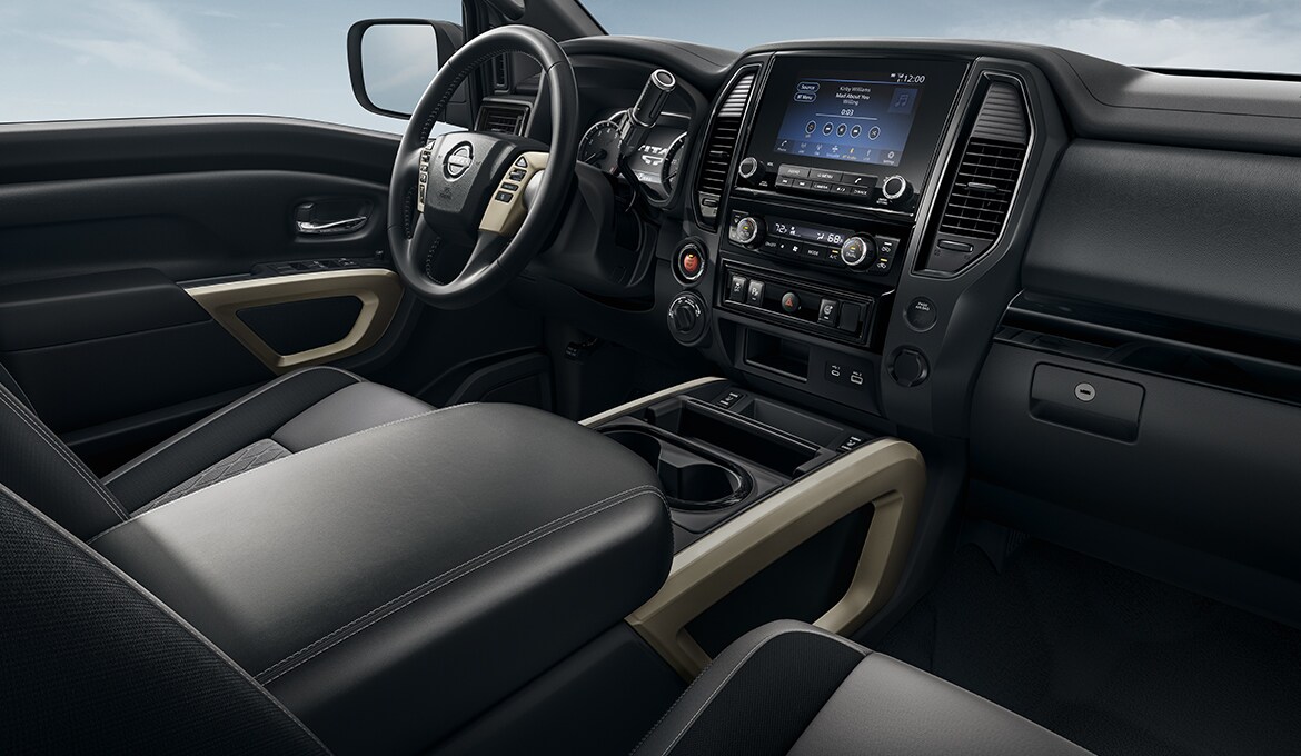 2024 Nissan TITAN bronze edition black cloth captain's chairs and bronze and black finishers