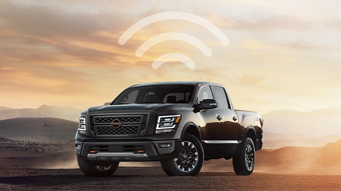 2024 Nissan TITAN in the desert with wi-fi symbol over it 