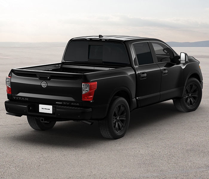 2024 Nissan TITAN Midnight Edition from behind showing cargo bed