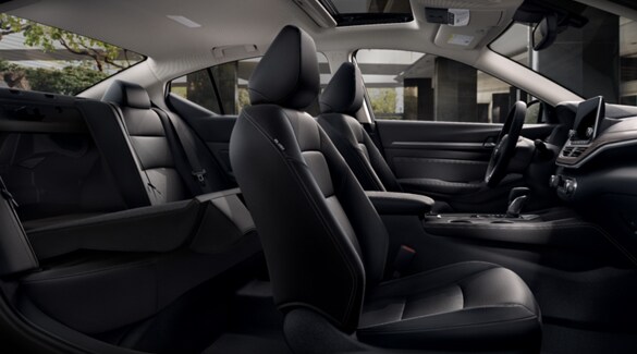 2022 Nissan Altima passenger seat fully reclined and back seats down showing 60/40 cargo split.