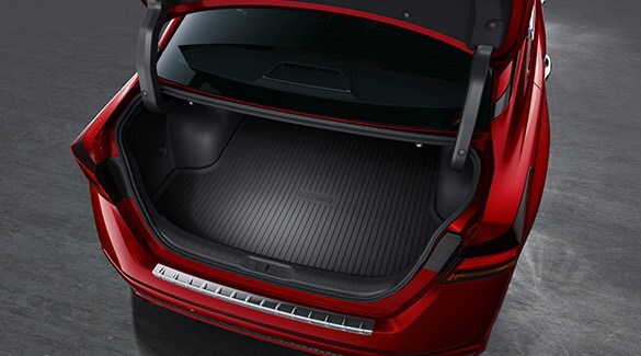 2022 Nissan Altima showing open trunk space to demonstrate cargo space.