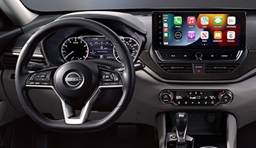 2023 Nissan Altima view from driver's seat showing gauges and 12.3-inch touch-screen illustrating connectivity.