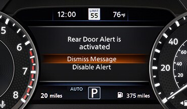 2023 Nissan Armada gauge screen showing rear door alert.