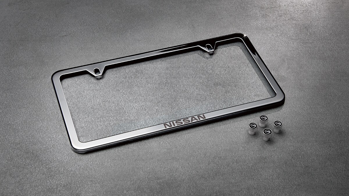 2022 Nissan Frontier Nissan polished aluminum slimline license plate frame and valve stem caps package