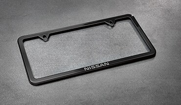 2022 Nissan Frontier Nissan black slimline license plate frame.