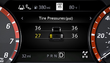 2023 Nissan Frontier gauge screen showing tire pressure monitoring system with easy-fill tire alert.