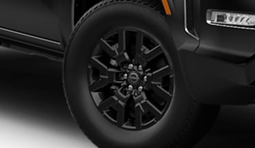 2023 Nissan Frontier 17-inch black aluminum-alloy wheels.