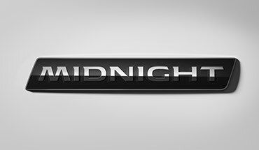 2023 Nissan Frontier Midnight Edition exclusive exterior badging.