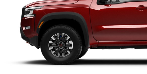 2023 Nissan Frontier 17-inch Dark-finished aluminum-alloy wheels with all-terrain tires.