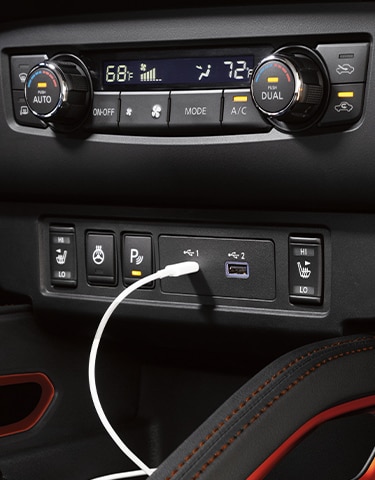 2024 Nissan Frontier interior view showing dual zone automatic temperature controls