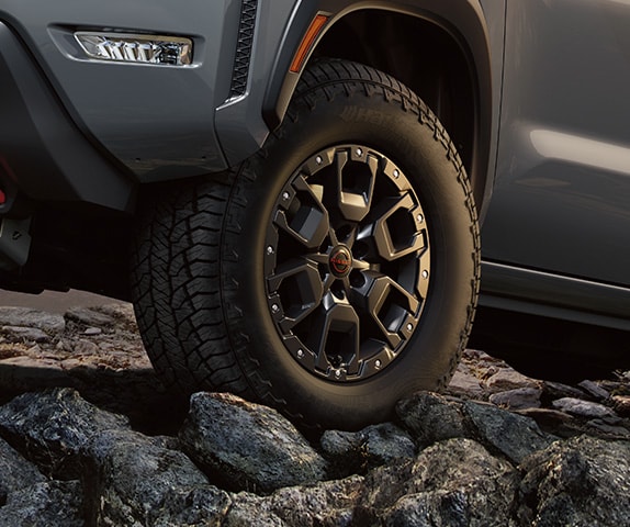 2024 Nissan Frontier PRO-4X detail view of all-terrain tire