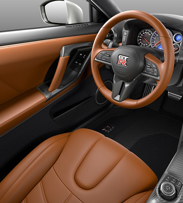 2021 Nissan GT-R showing tan leather driver's seat, door, and steering wheel