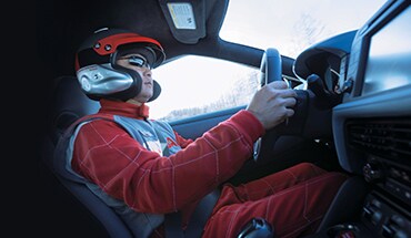 2021 Nissan GT-R picture of a racecar driver behind the wheel with helmet on