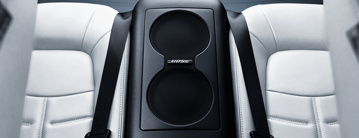 2023 Nissan GT-R interior view of rear seats showing subwoofer for Bose Premium Audio System.
