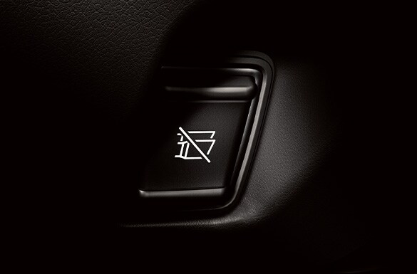 2023 Nissan GT-R detail of titanium exhaust sound control button.