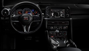 2023 Nissan GT-R interior view of cockpit-style instrument panel.
