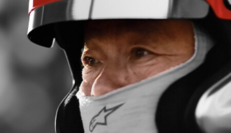 2023 Nissan GT-R NISMO profile of test driver wearing helmet.