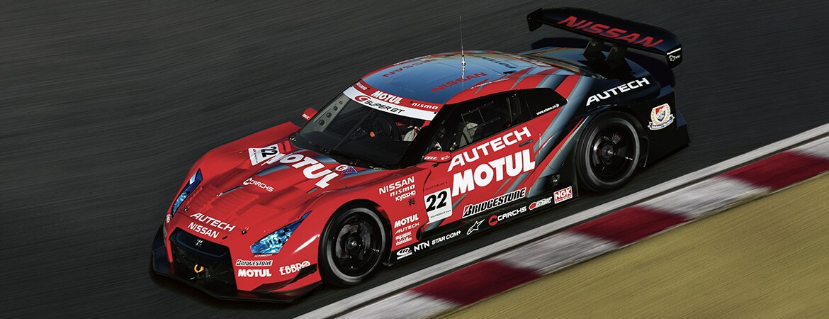 Nissan Super GT race car on track.