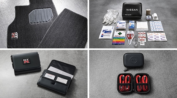 2024 Nissan GT-R view of two floor mats with GT-R logo, contents of an first-aid kit, a GT-R owner's manual portfolio, and USB charging cable set.