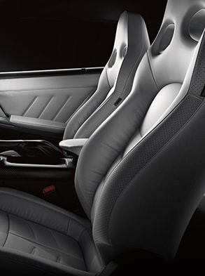 2024 Nissan GT-R interior view of front seats with premium seating appointments.