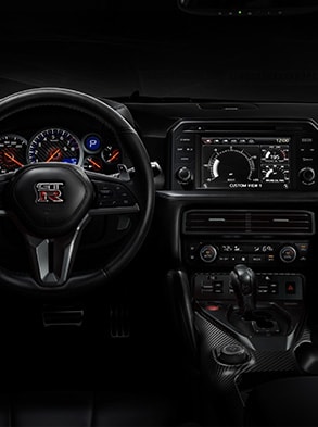 2024 Nissan GT-R cockpit view showing multi-function display system.