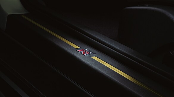 2024 Nissan GT-R T-spec interior showing T-spec kick plate.